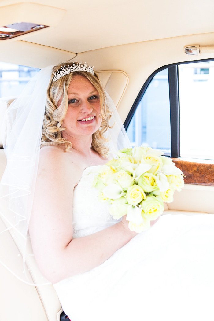 Bride in wedding car