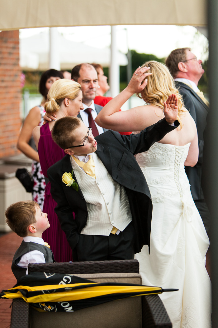 Bride and groom releasing balloons