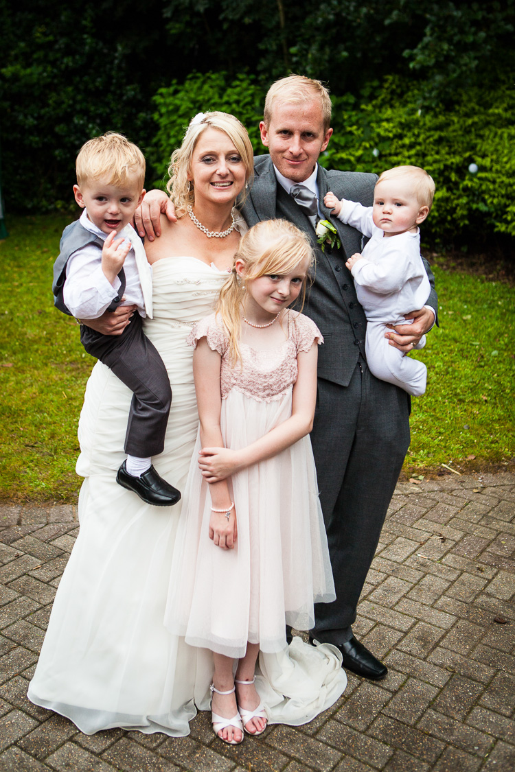 Bride and groom with family