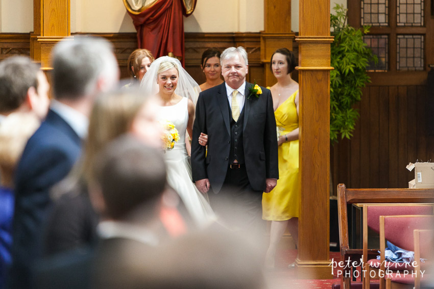 Bride with father walking down aisle