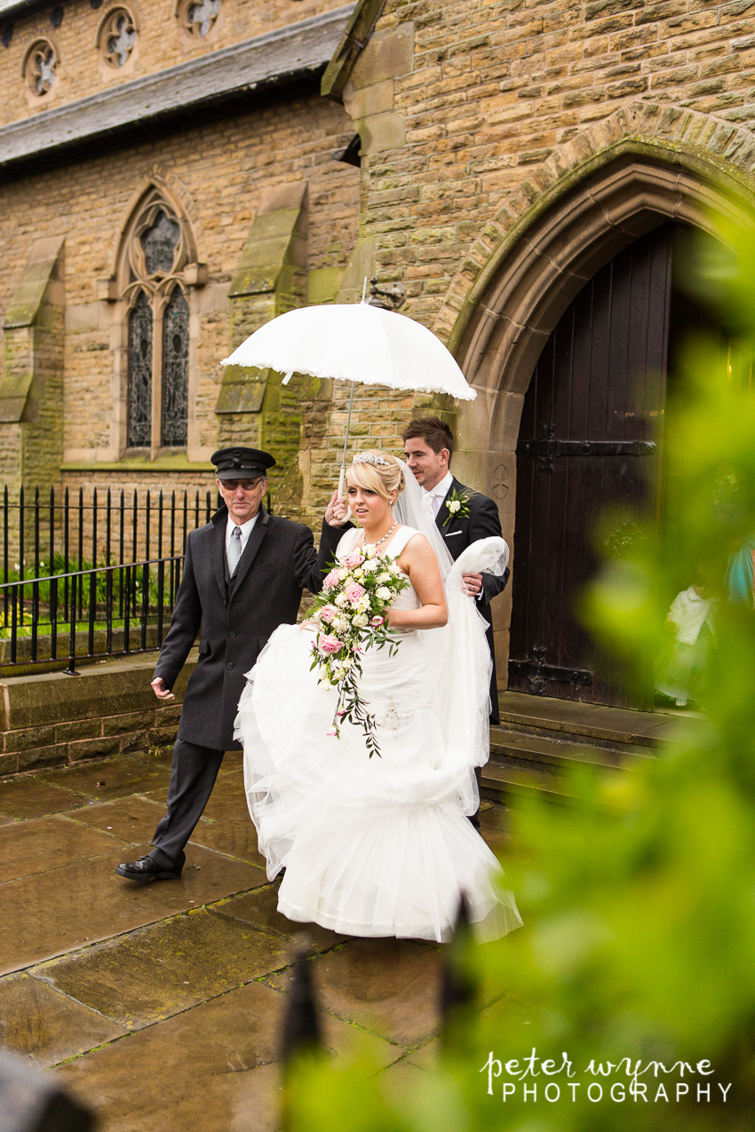 Bride and Groom in rain