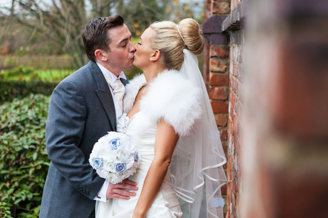 Bride and groom kissing portrait
