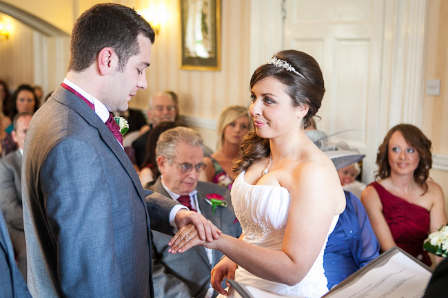 Bride and groom exchanging rings