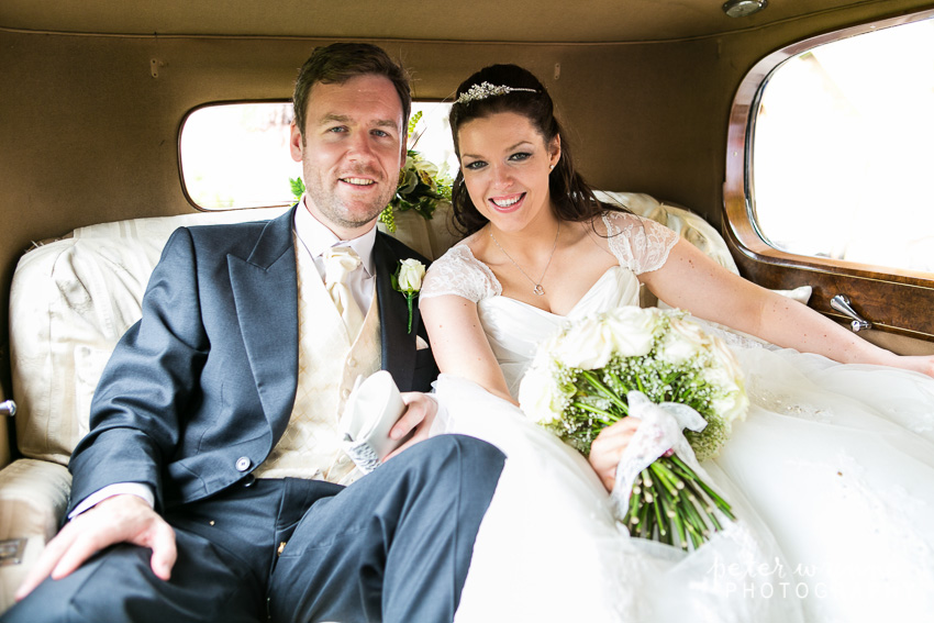 bride and groom in car