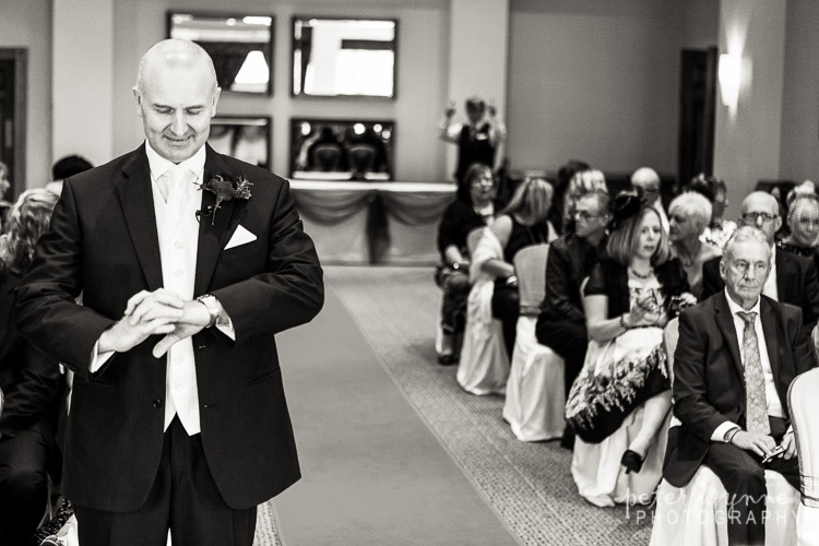 Groom waiting at ceremony