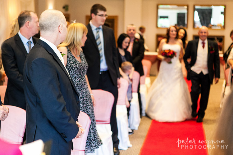 Groom waiting at ceremony