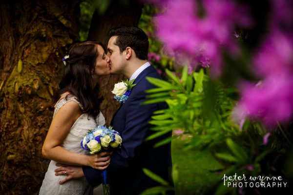 Bride and groom kissing at The Bryn Howell