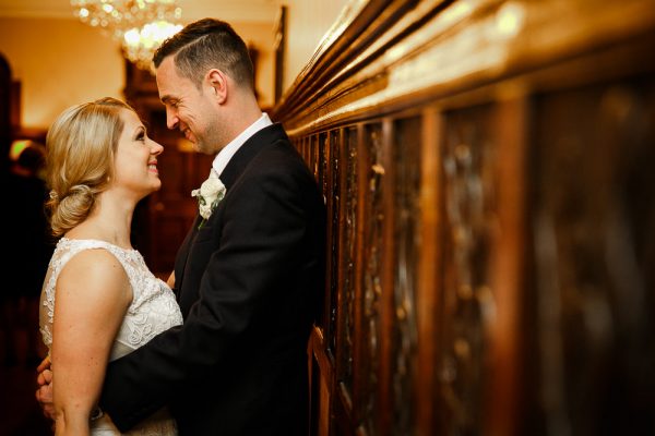 bride and groom embrace at rowton hall