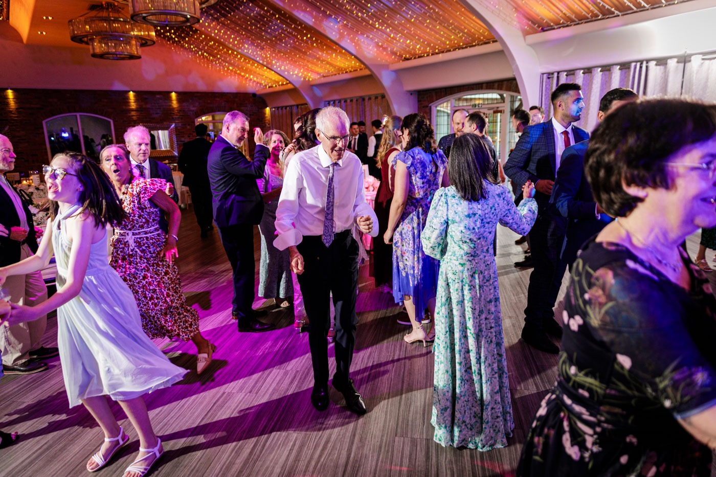 guests dancing on dance floor at colshaw hall