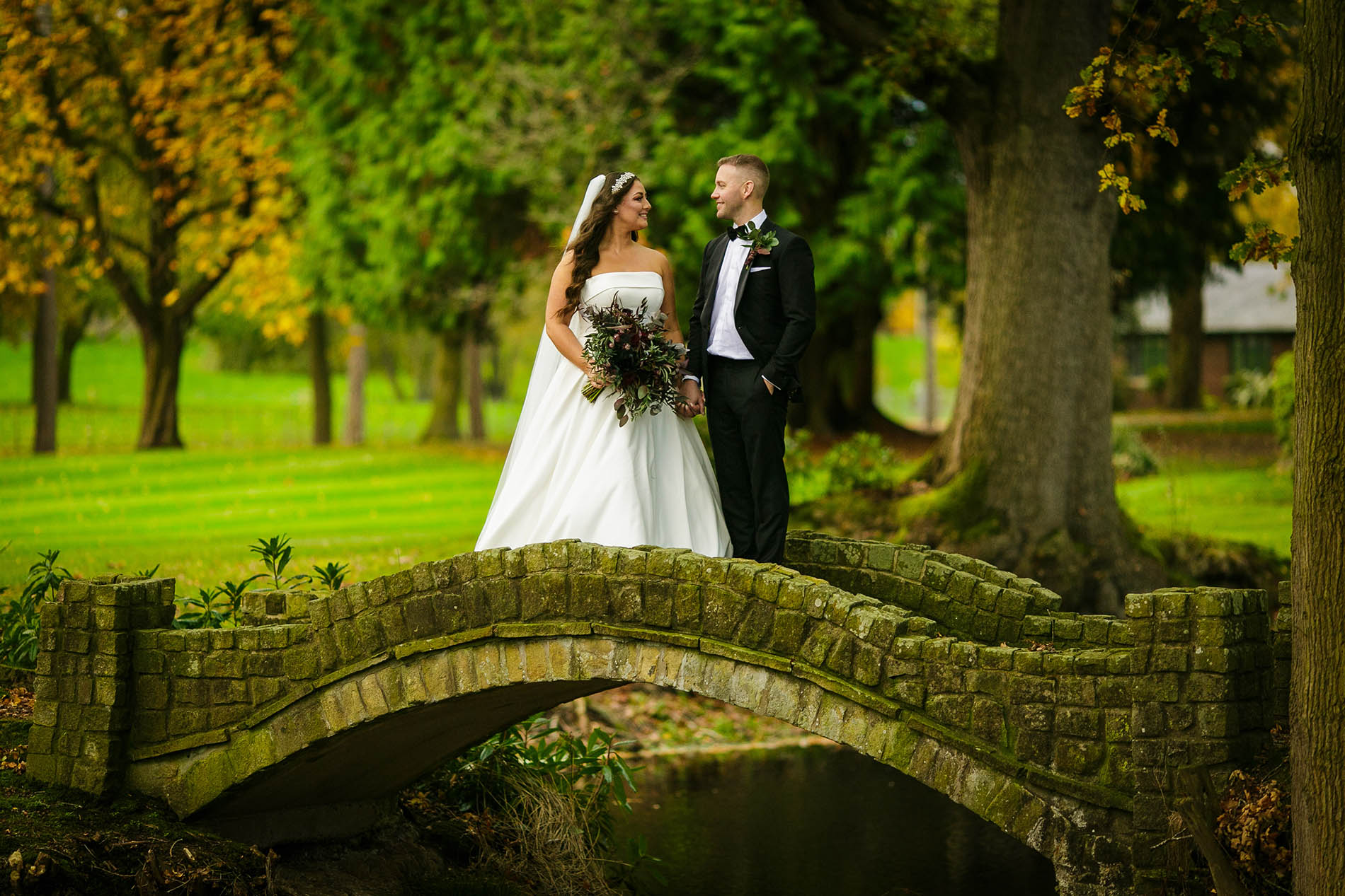 bride and groom holding hands at colshaw hall