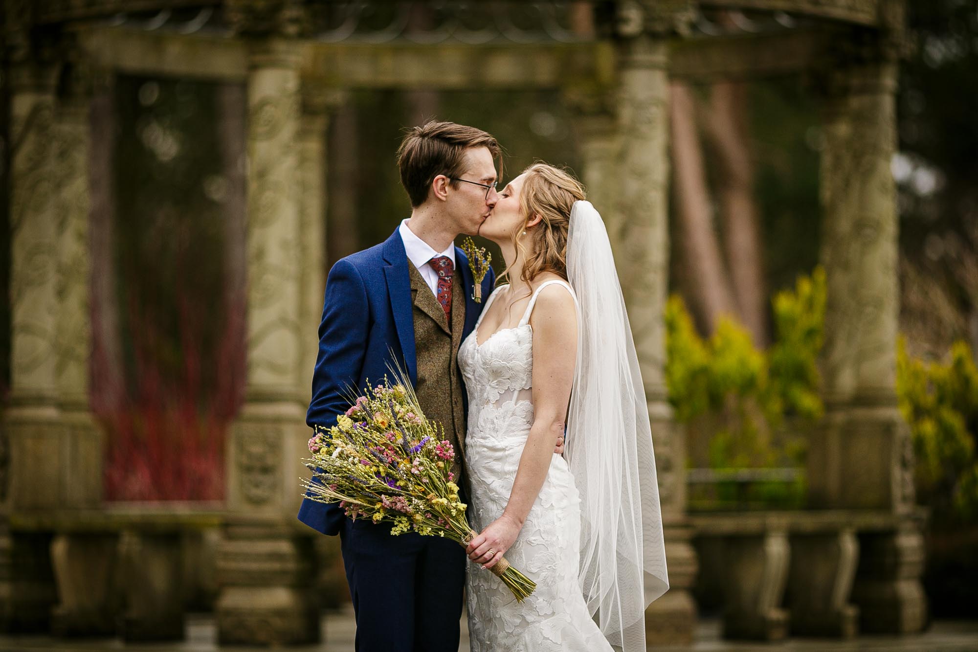 bride and groom kissing in gardens at hillbark hotel