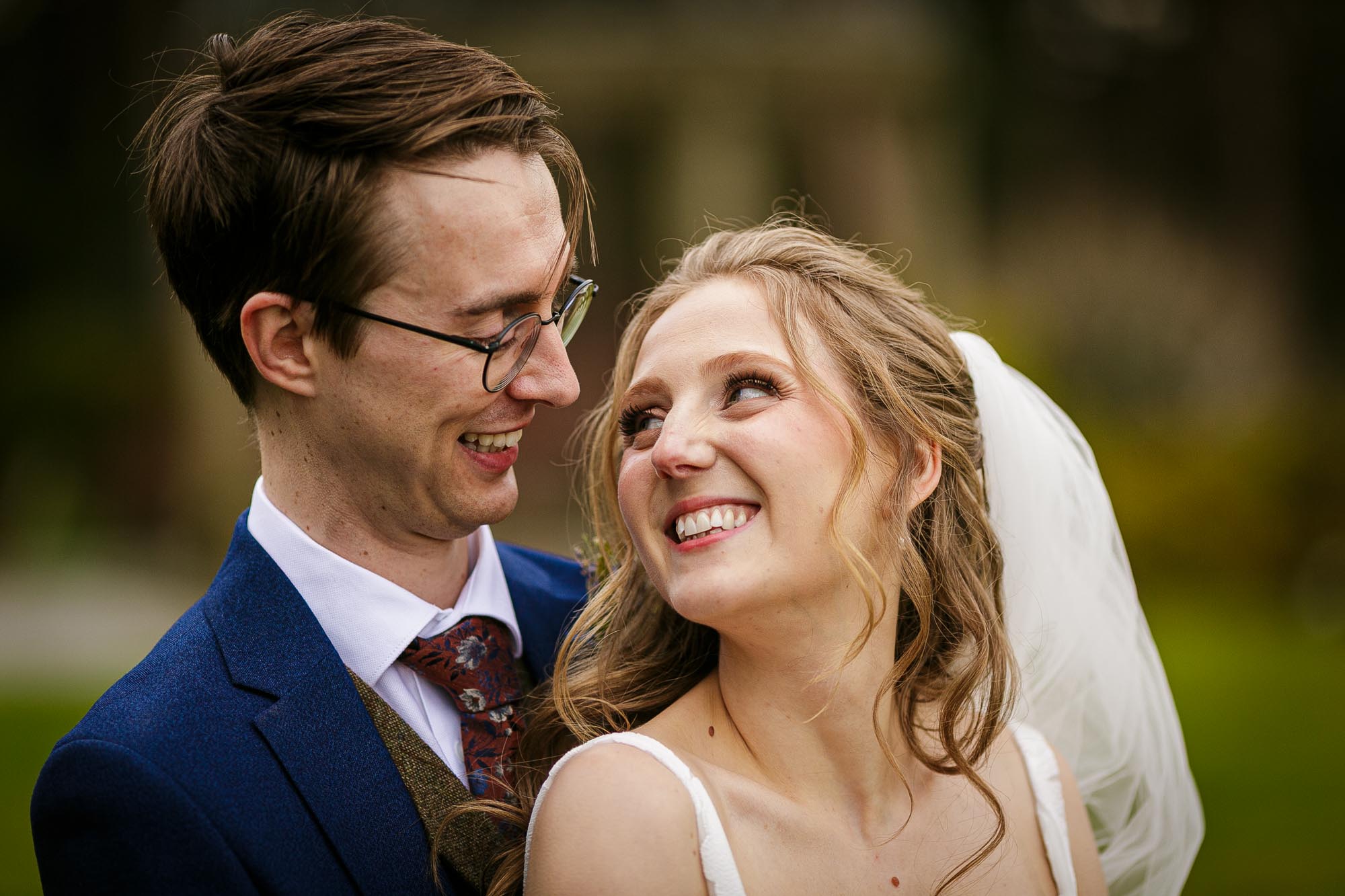 close up of bride and groom looking at each other