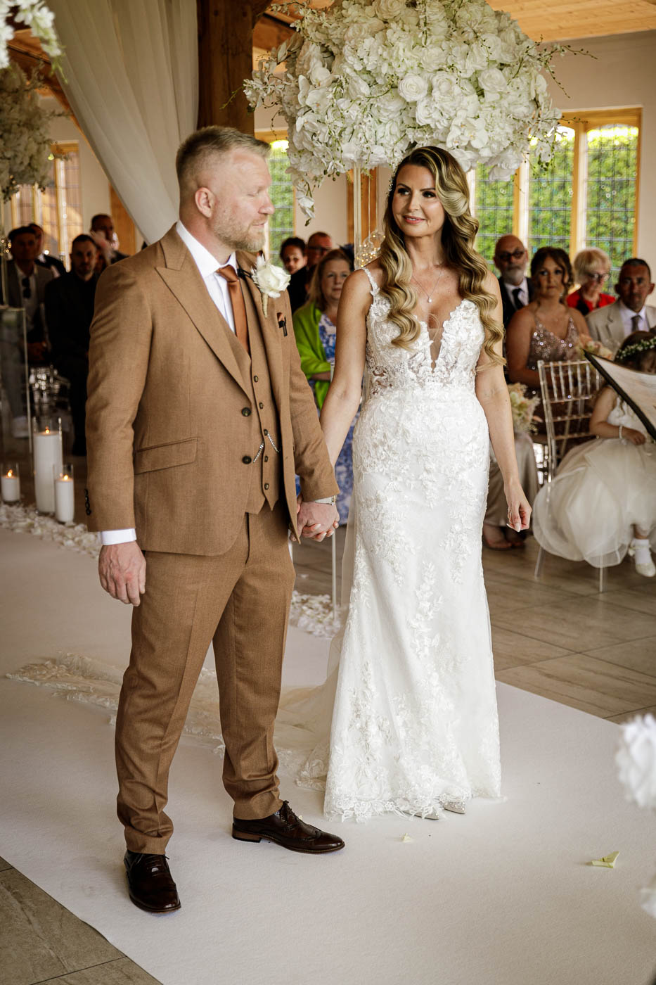 bride looking and groom at wedding ceremony