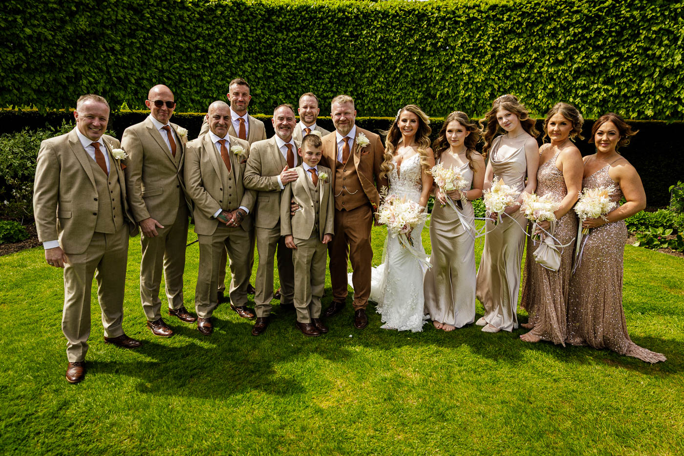 groomsmen and bridal party photo in gardens at merrydale manor