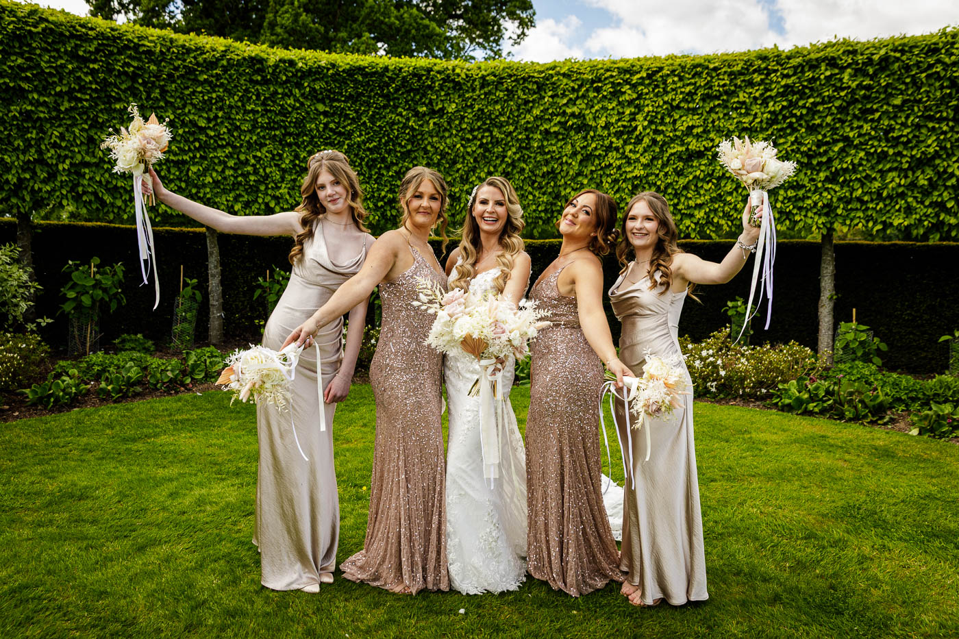bride and bridemaids fun photo in gardens at merrydale