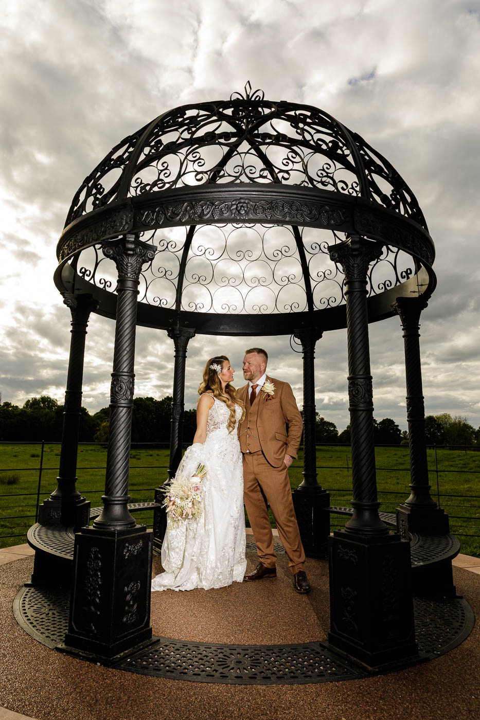 bride and groom portrait in gazebo at merrydale