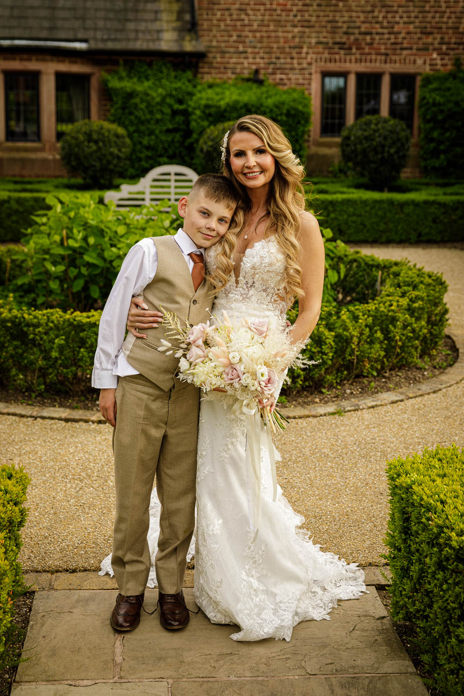 bride with son in gardens