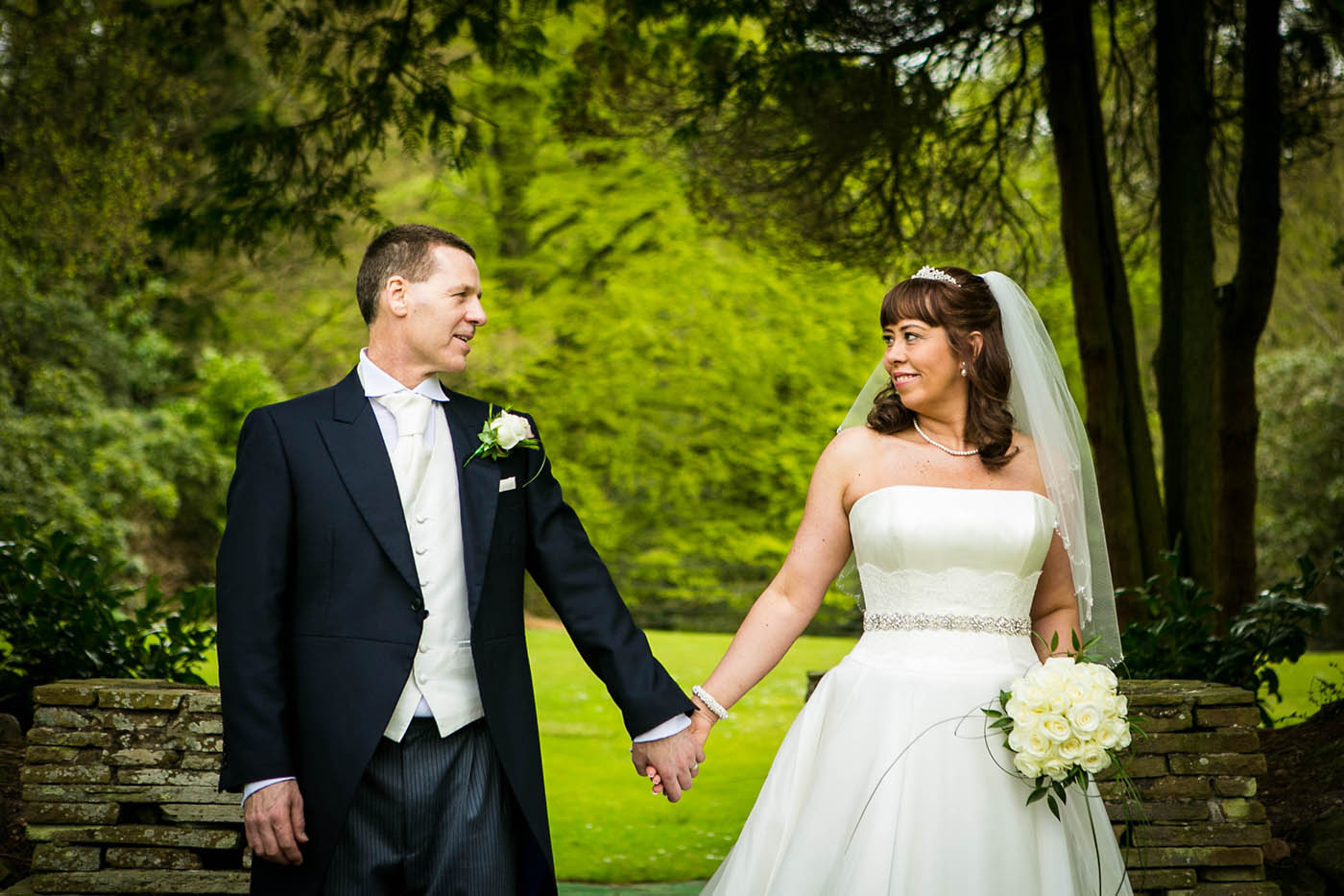 bride and groom portrait in gardens at mottram hall