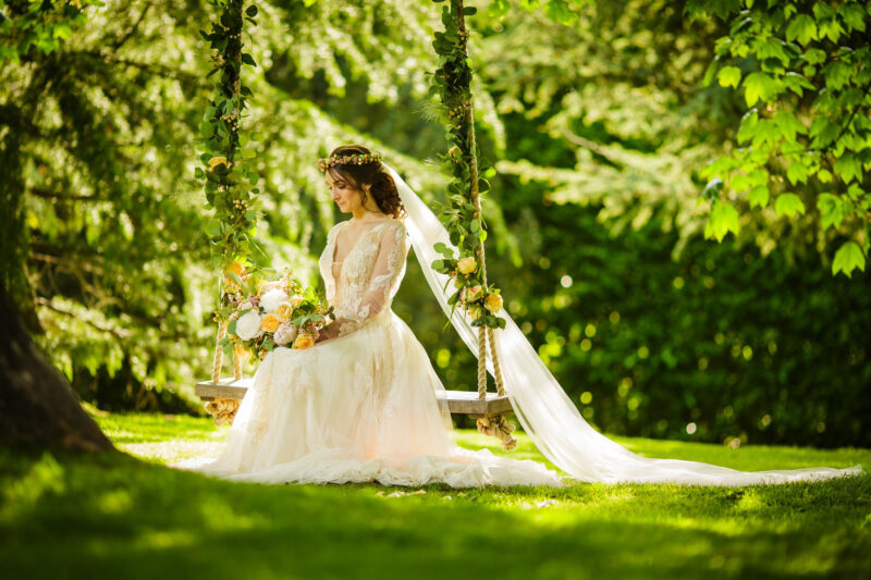 bride on wedding swing at soughton hall