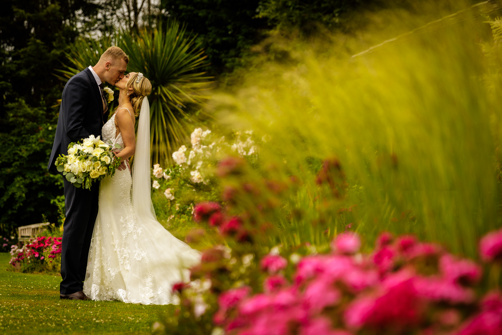 bride and groom kissing at wrenbury hall