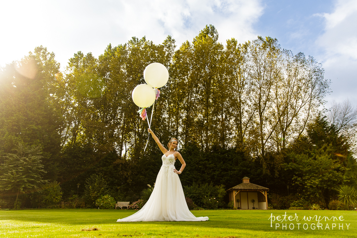 Bride with festival balloons at Wrenbury Hall