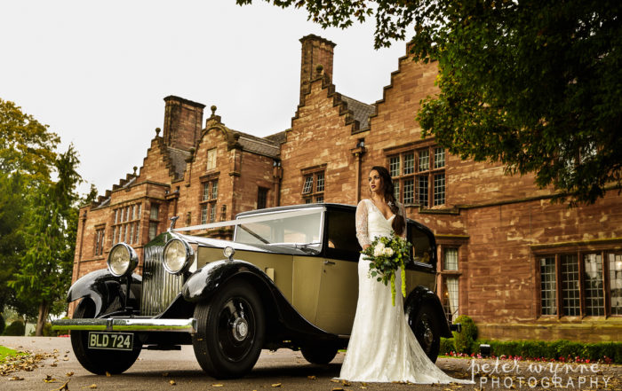 Wrenbury Hall bridal portrait with wedding car