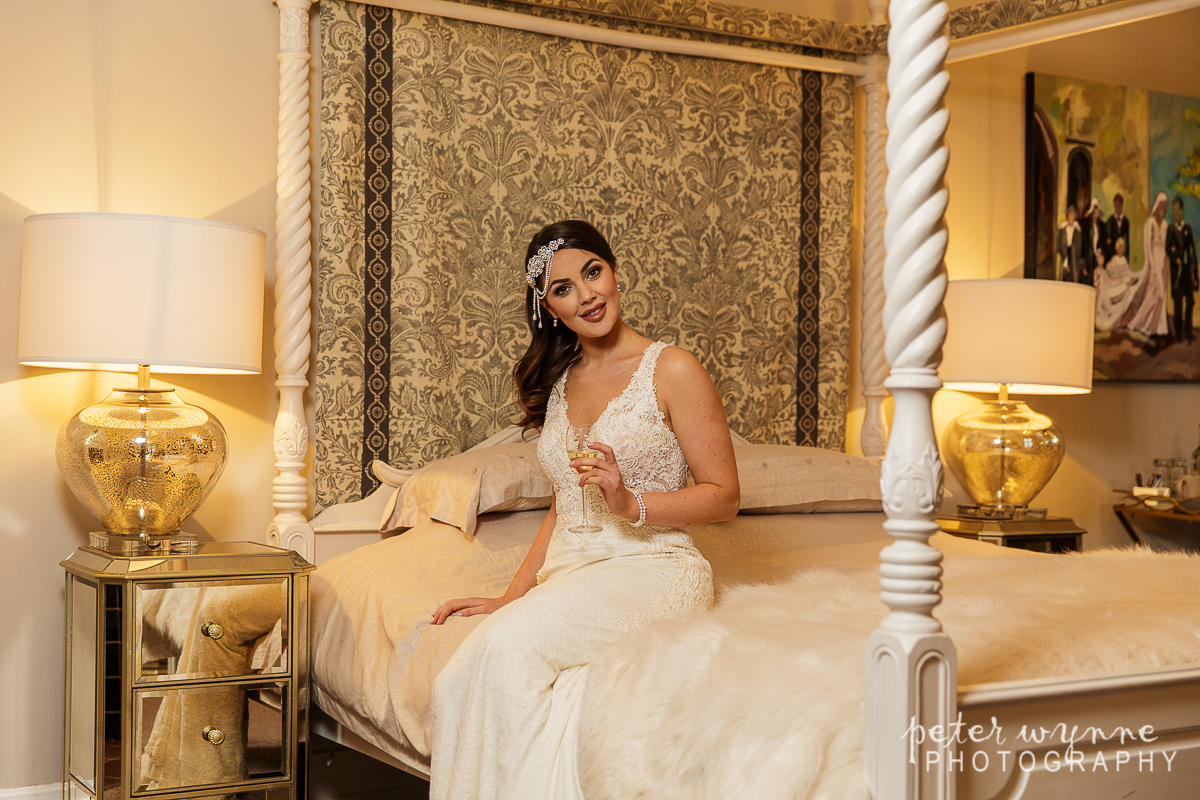 Bride posing in Wrenbury Hall bridal suite